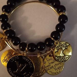 This is a beaded bracelet and bangle bracelet charm bracelet it is a set